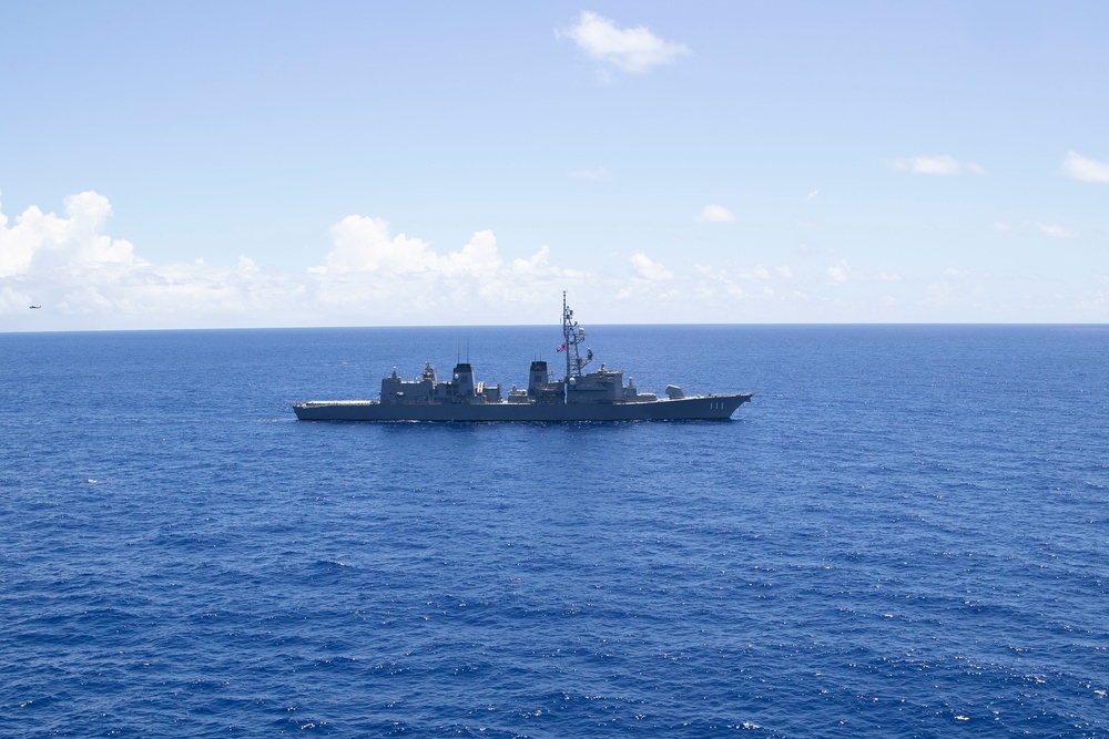 JS Ohnami (DD 111) Sails with USS Tripoli (LHA 7)