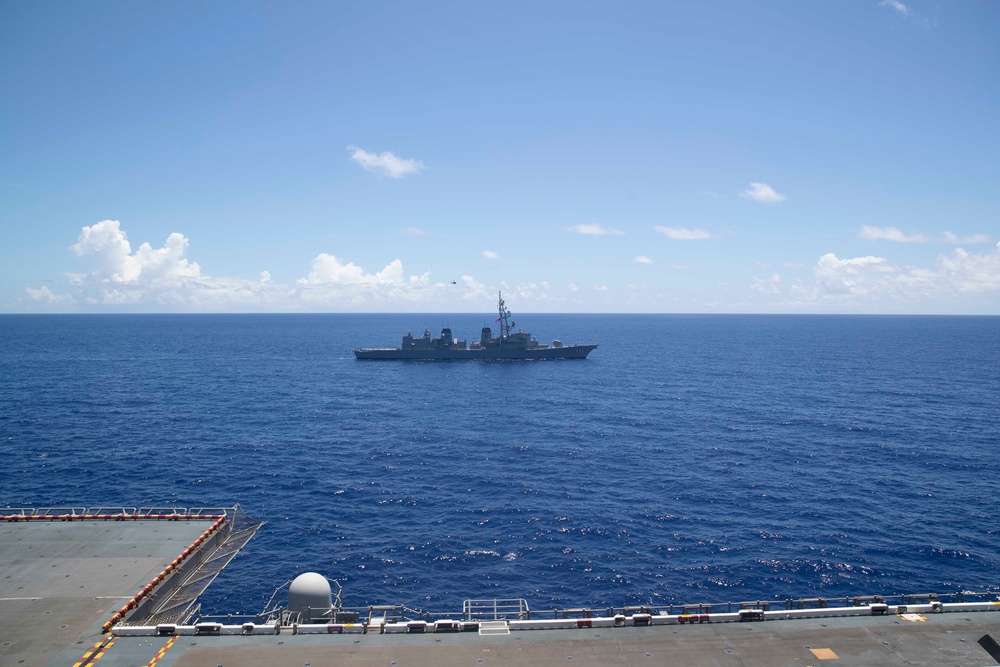 JS Ohnami (DD 111) Sails with USS Tripoli (LHA 7)