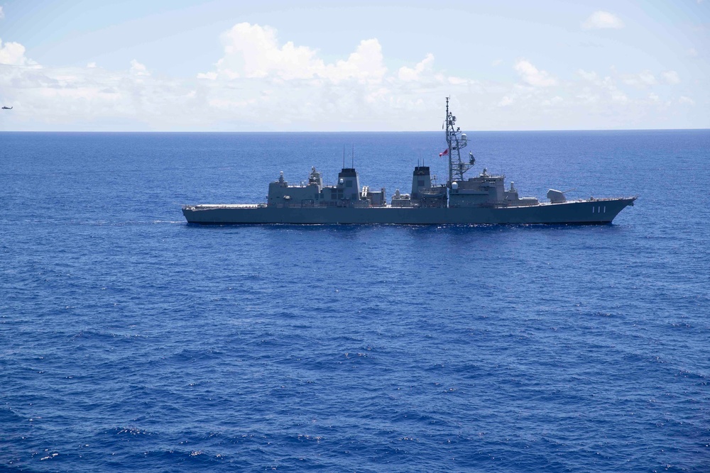 JS Ohnami (DD 111) Sails with USS Tripoli (LHA 7)