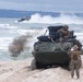 Light Armored Vechiles drive ashore during a U.S. – Sweden bilateral exercise