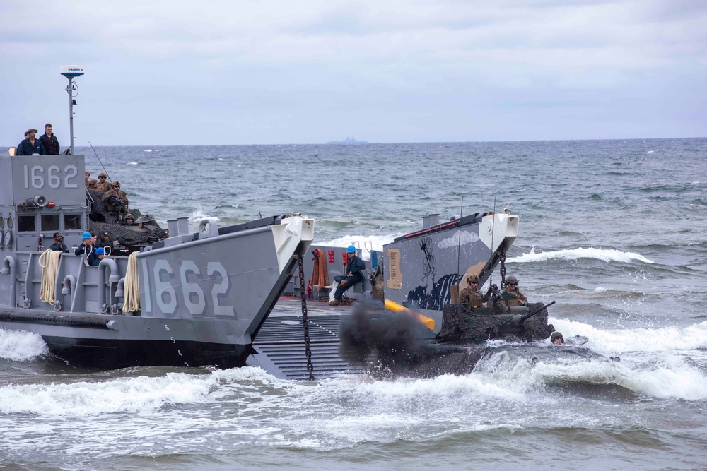 Landing Craft Utility 1662 unloads a Light Armored Vechicle