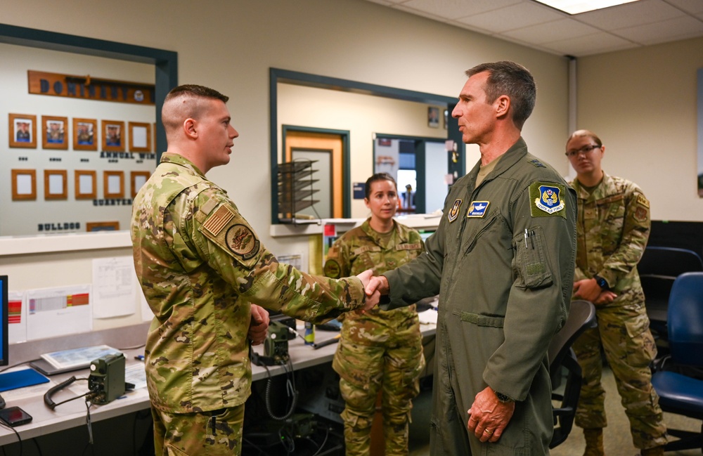 Maj. Gen. Bryan Radliff coins Master Sgt. Trevor Bethel