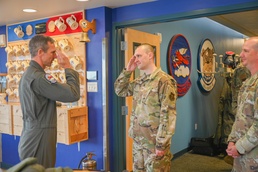Maj. Gen. Bryan Radliff coins Tech. Sgt. Connor Otten
