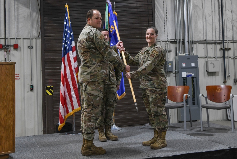 477th Fighter Group commander, passes the guidon to new 477th Maintenance Squadron commander