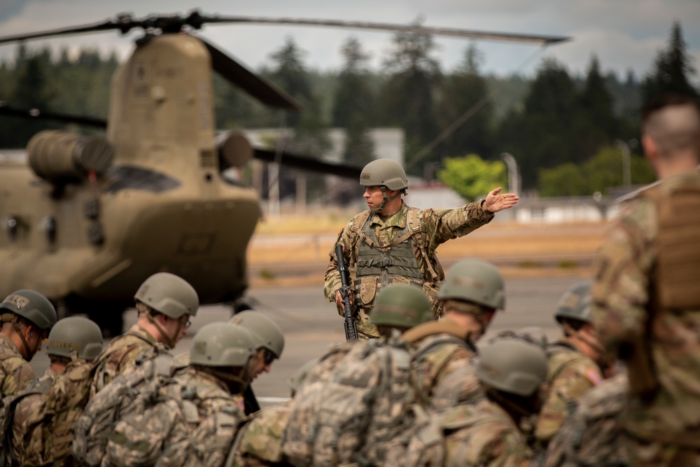 Prepare for departure: Army National Guard officer candidates prep for air infiltration during Officer Candidate School Phase III