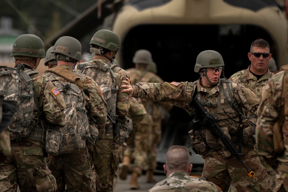 Prepare for departure: Army National Guard officer candidates prep for air infiltration during Officer Candidate School Phase III