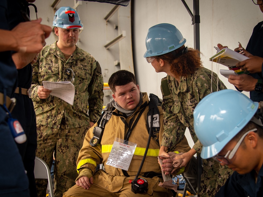 USS Carl Vinson (CVN 70) Sailors Conduct Fire Casualty Drill with San Diego Federal Fire Department