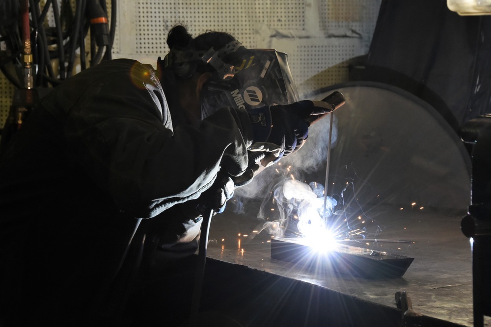 Coast Guard Cutter Healy crewmember welding