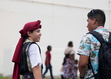 CAMP FOSTER, OKINAWA, Japan – Dancers and singers with Jaagaru Eisa Group performed an Eisa dance on Camps Foster, Lester and the Plaza Housing area on Aug. 21.