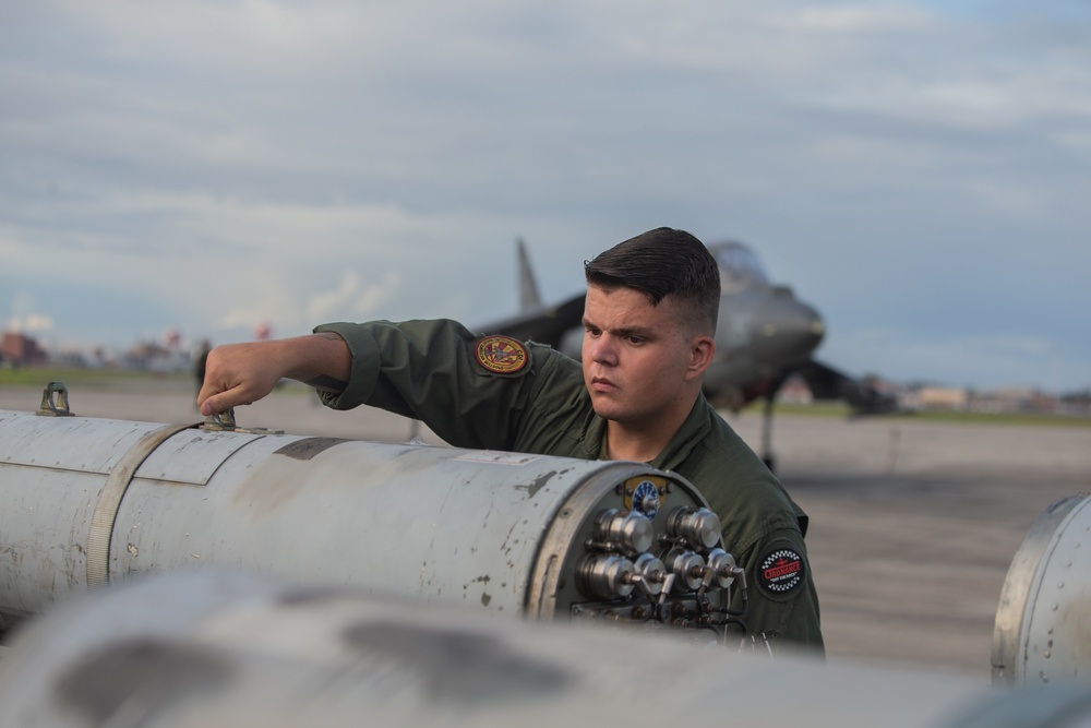 New Tricks For An Old Dog: Marines with VMA-223 load Air-to-Air missiles onto Harriers