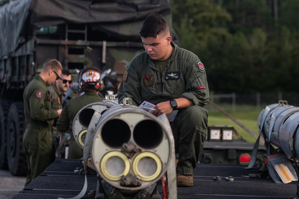 New Tricks For An Old Dog: Marines with VMA-223 load Air-to-Air missiles onto Harriers