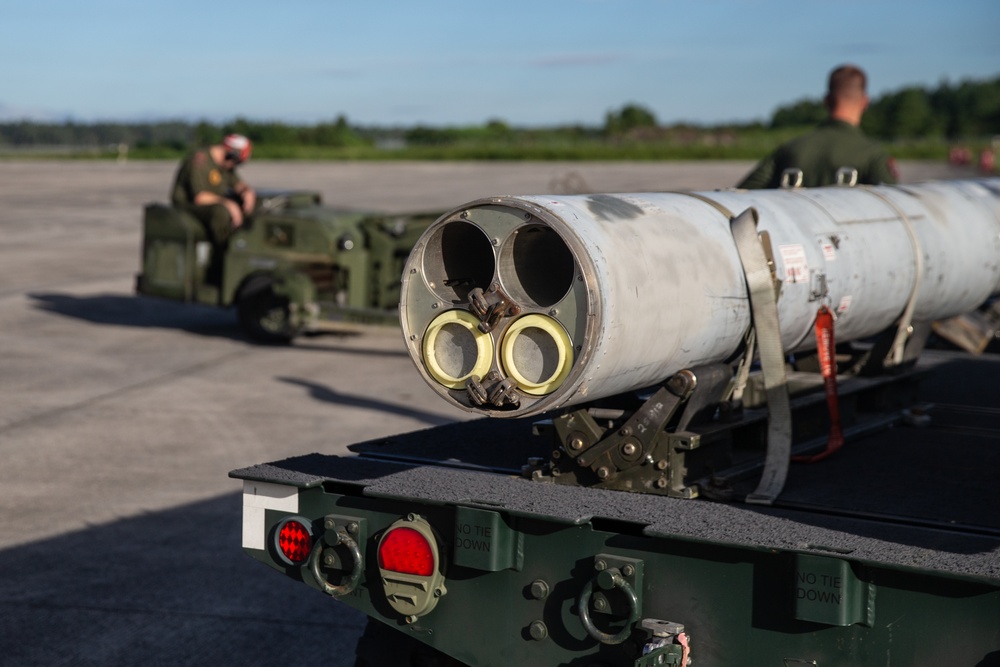 New Tricks For An Old Dog: Marines with VMA-223 load Air-to-Air missiles onto Harriers