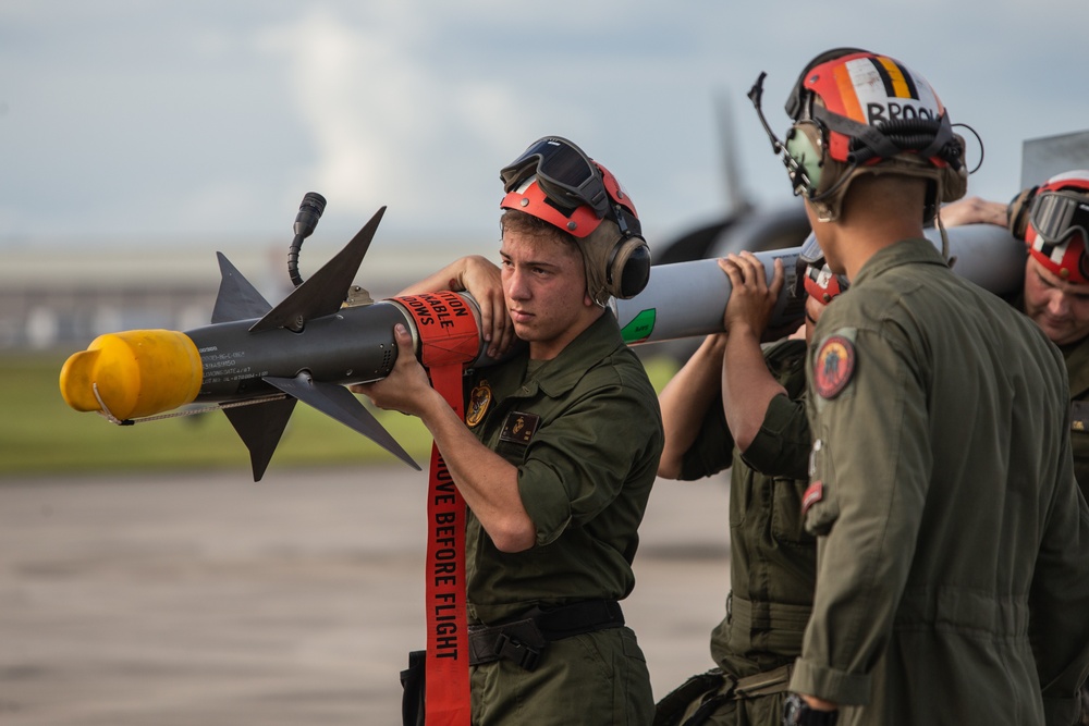 New Tricks For An Old Dog: Marines with VMA-223 load Air-to-Air missiles onto Harriers