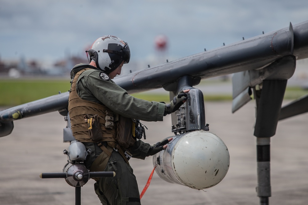 New Tricks For An Old Dog: Marines with VMA-223 load Air-to-Air missiles onto Harriers