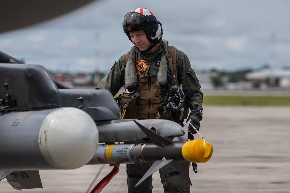 New Tricks For An Old Dog: Marines with VMA-223 load Air-to-Air missiles onto Harriers