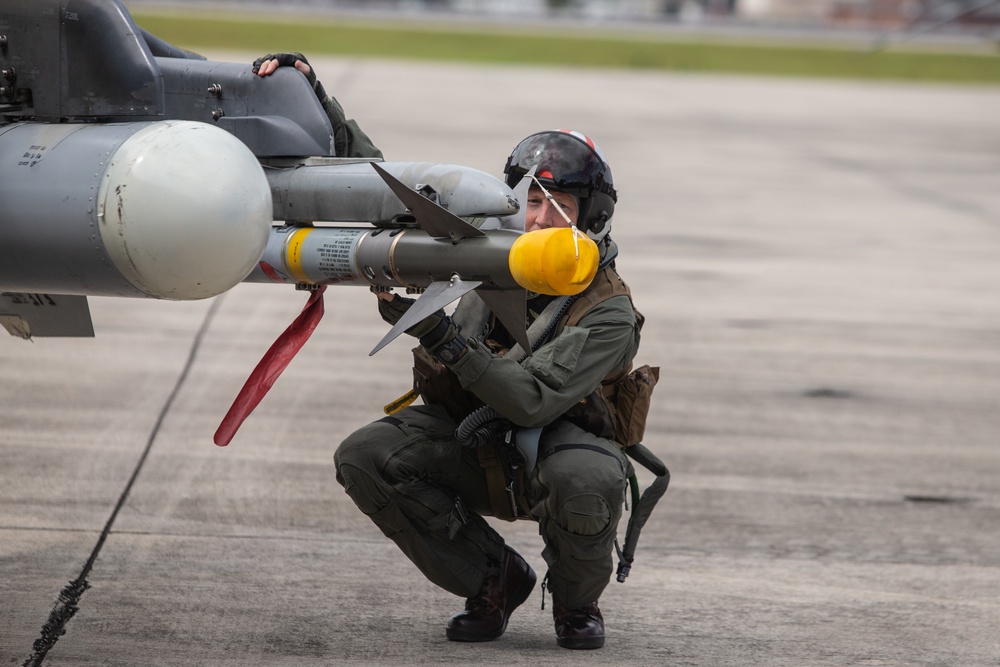 New Tricks For An Old Dog: Marines with VMA-223 load Air-to-Air missiles onto Harriers