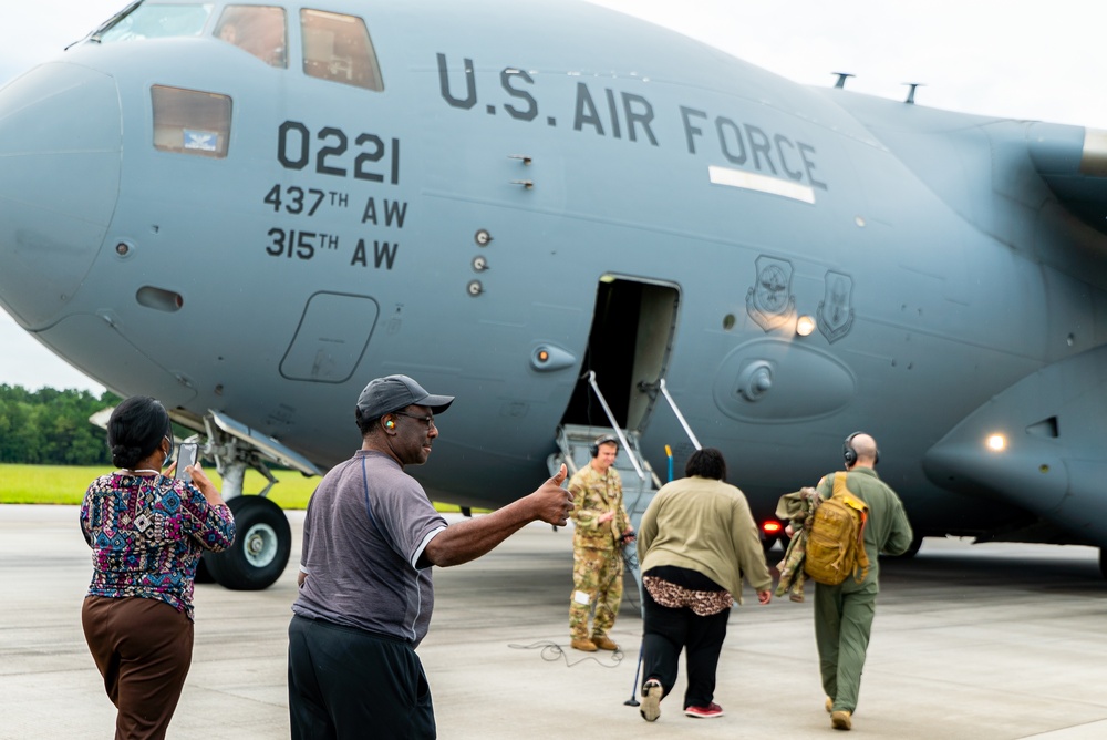 Local mayor visits AMC training field, catches a ride on C-17