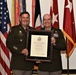 Retiring AMC operations officer recognized for leadership during major world events