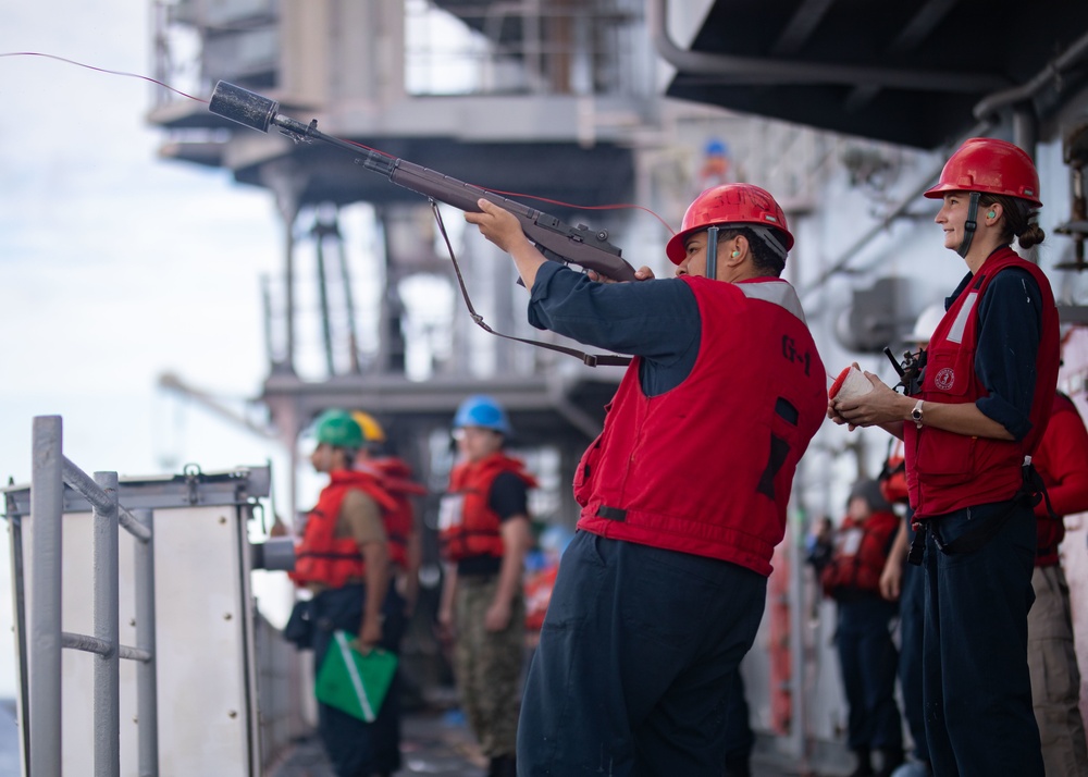 USS Bataan Sailors perform replenishment at sea