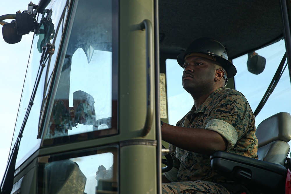 Marines with Combat Logistics Battalion 4 load and transport quadcons