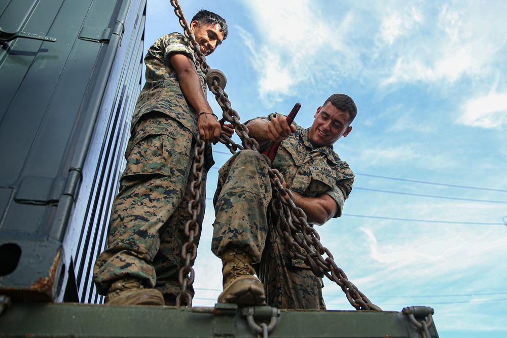 Marines with Combat Logistics Battalion 4 load and transport quadcons