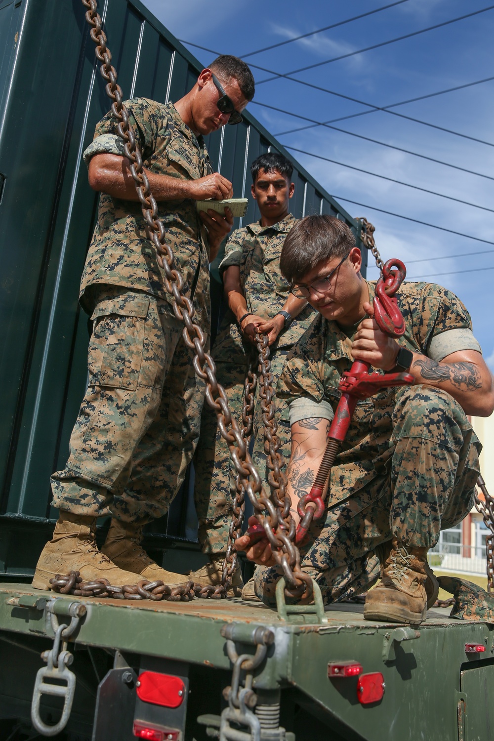 Marines with Combat Logistics Battalion 4 load and transport quadcons