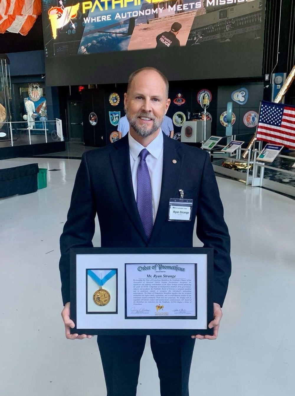 Ryan Strange receives the Order of Prometheus Medallion and Award from AUSVI