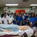 U.S. Navy Sailors, Solomon Islands nurses practice nursing skills aboard USNS Mercy