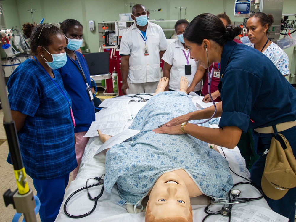 U.S. Navy Sailors, Solomon Islands nurses practice nursing skills aboard USNS Mercy