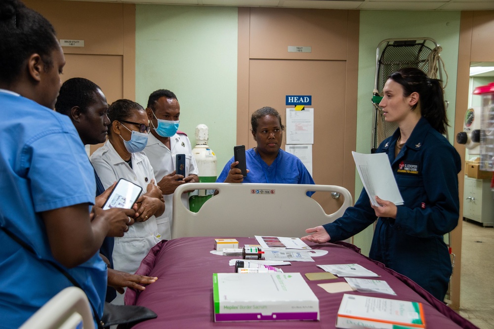 U.S. Navy Sailors, Solomon Islands nurses practice nursing skills aboard USNS Mercy