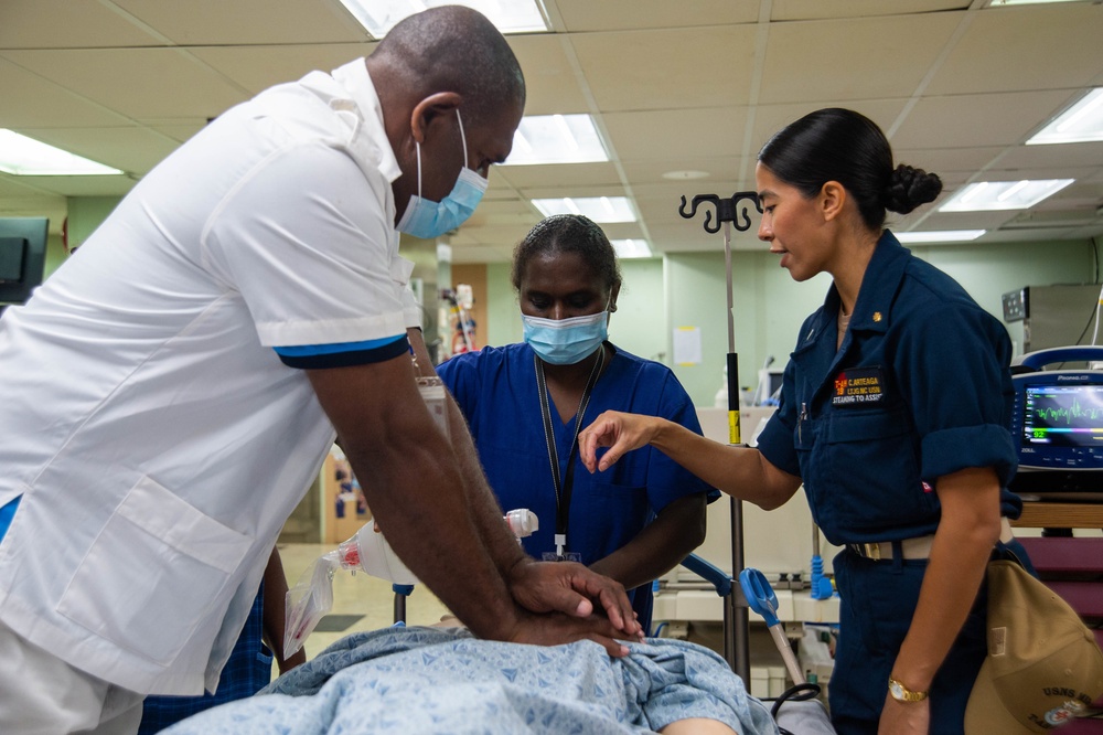 U.S. Navy Sailors, Solomon Islands nurses practice nursing skills aboard USNS Mercy