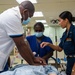 U.S. Navy Sailors, Solomon Islands nurses practice nursing skills aboard USNS Mercy