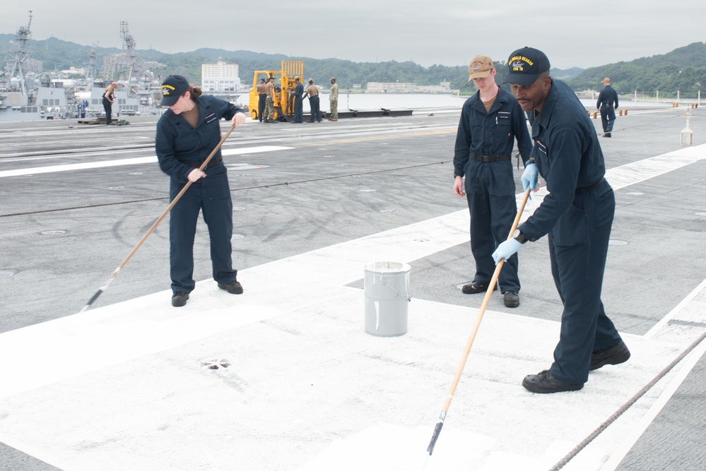 USS Ronald Reagan (CVN 76) Sailors perform work on the flight deck