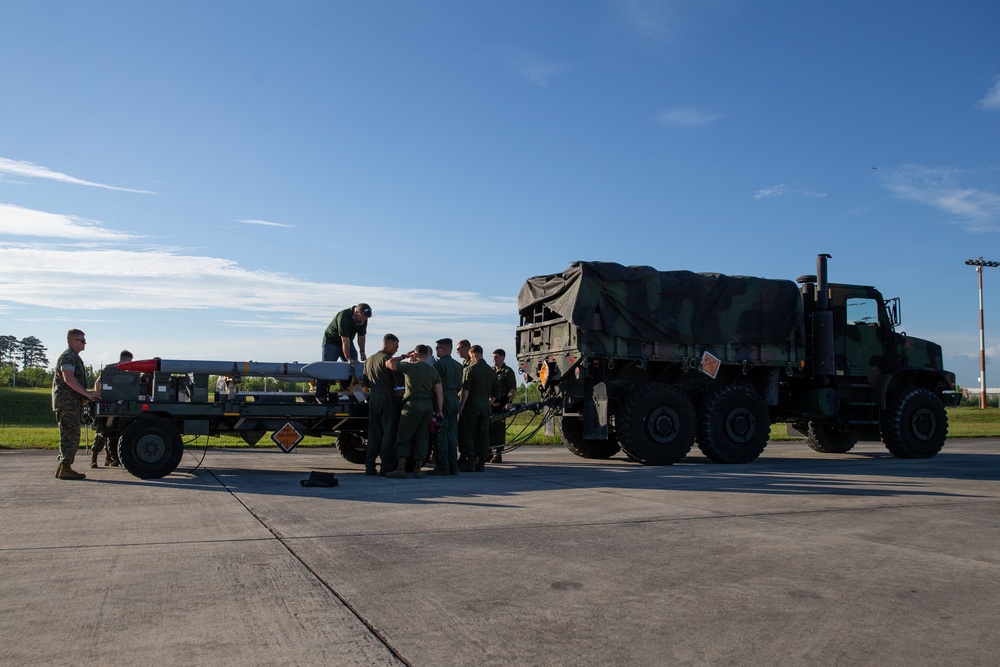 New Tricks For An Old Dog: Marines with VMA-223 load Air-to-Air missiles onto Harriers