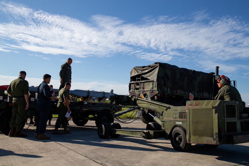 New Tricks For An Old Dog: Marines with VMA-223 load Air-to-Air missiles onto Harriers