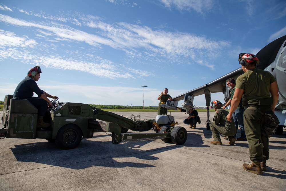 New Tricks For An Old Dog: Marines with VMA-223 load Air-to-Air missiles onto Harriers