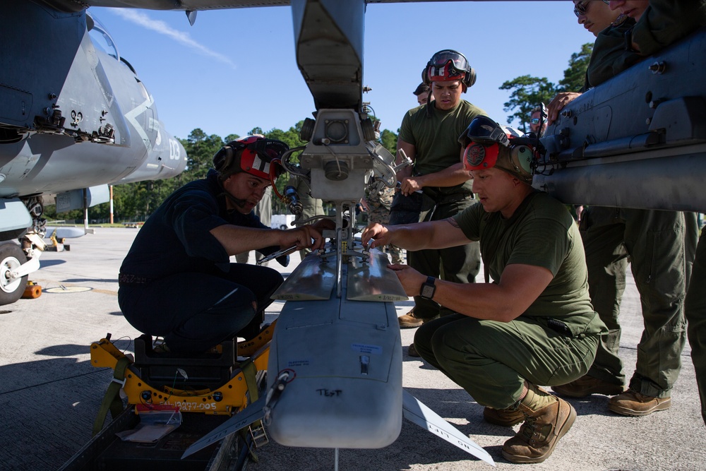 New Tricks For An Old Dog: Marines with VMA-223 load Air-to-Air missiles onto Harriers