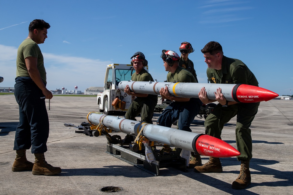 New Tricks For An Old Dog: Marines with VMA-223 load Air-to-Air missiles onto Harriers