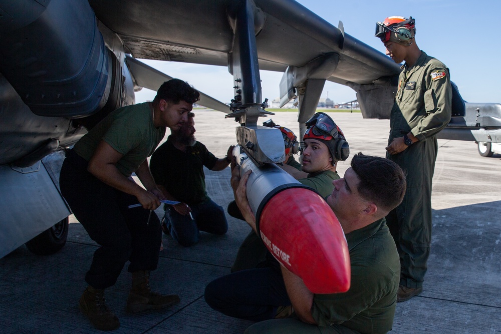 New Tricks For An Old Dog: Marines with VMA-223 load Air-to-Air missiles onto Harriers