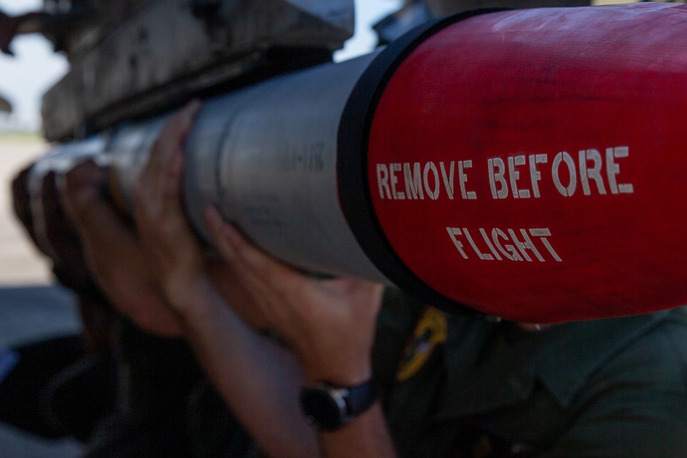 New Tricks For An Old Dog: Marines with VMA-223 load Air-to-Air missiles onto Harriers