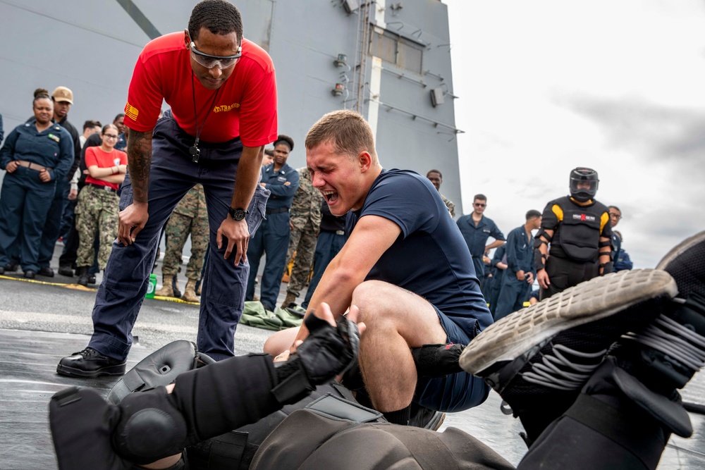 USS Arlington Sailors take on security reaction force training