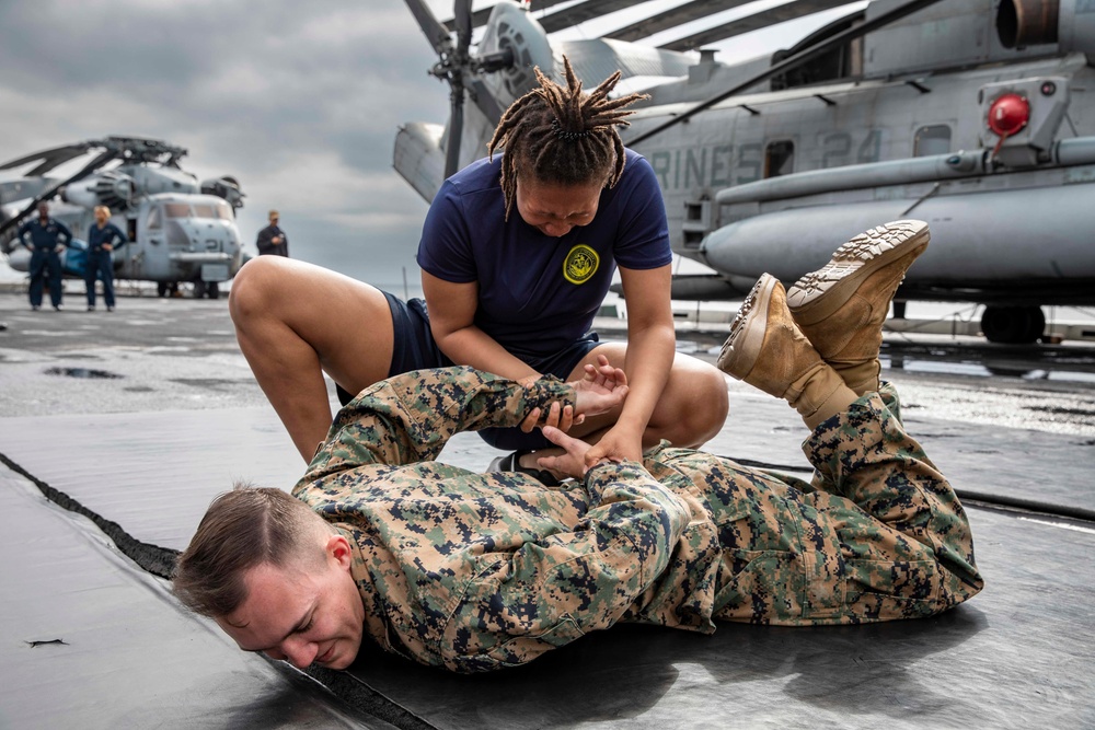 USS Arlington Sailors take on security reaction force training