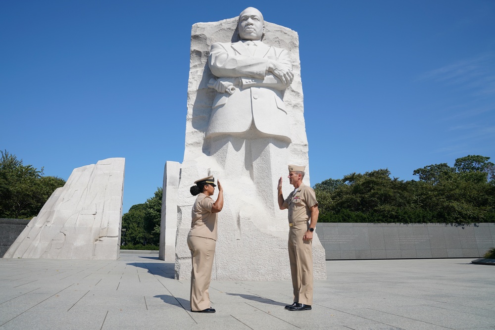 Brittni N. King is promoted to the rank of Lt. Cmdr. by Capt. Eric J. Hawn