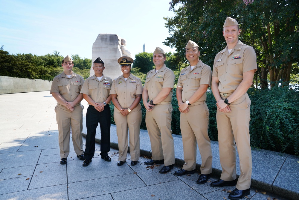 LCDR Brittni King with fellow Seabees at her promotion ceremony