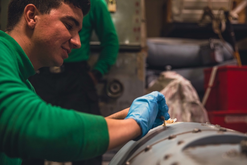 HSM 79 Sailors Repair MH-60R Auxiliary Fuel Tank aboard DDG 117