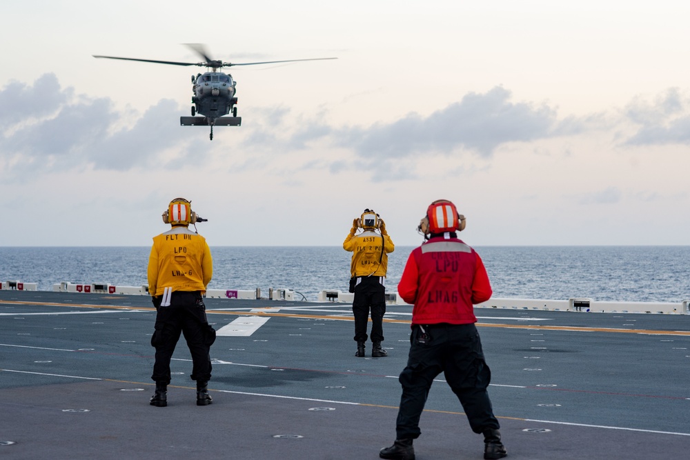 USS America (LHA 6) Conducts Vertical Replenishment Exercise With Helicopter Sea Combat (HSC) Squadron 25
