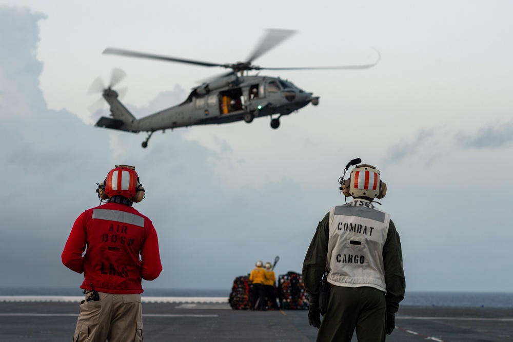 USS America (LHA 6) Conducts Vertical Replenishment Exercise With Helicopter Sea Combat (HSC) Squadron 25
