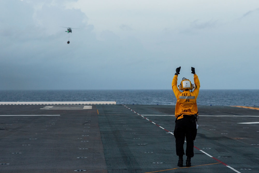 USS America (LHA 6) Conducts Vertical Replenishment Exercise With Helicopter Sea Combat (HSC) Squadron 25