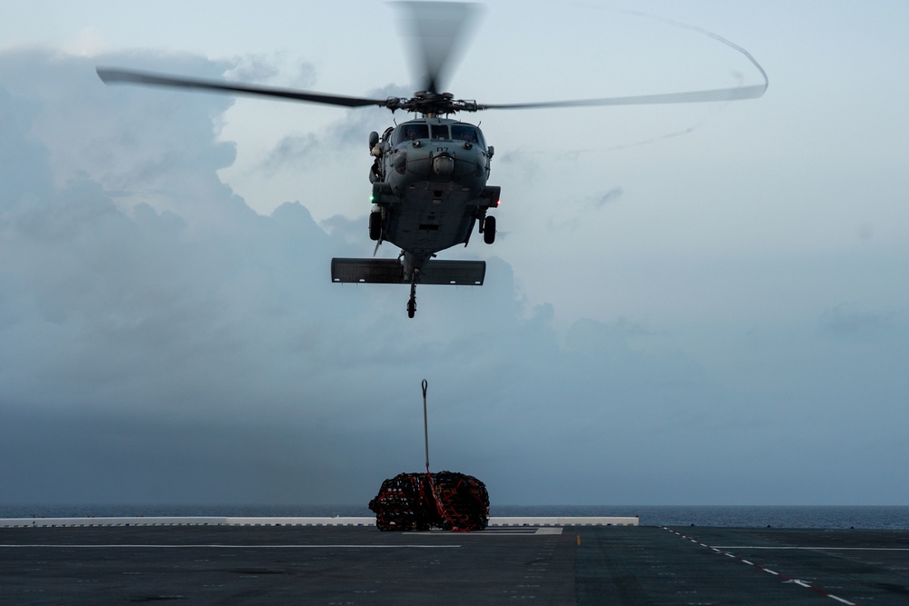 USS America (LHA 6) Conducts Vertical Replenishment Exercise With Helicopter Sea Combat (HSC) Squadron 25