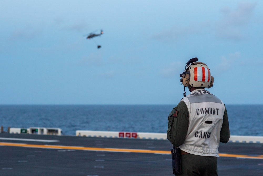 USS America (LHA 6) Conducts Vertical Replenishment Exercise With Helicopter Sea Combat (HSC) Squadron 25